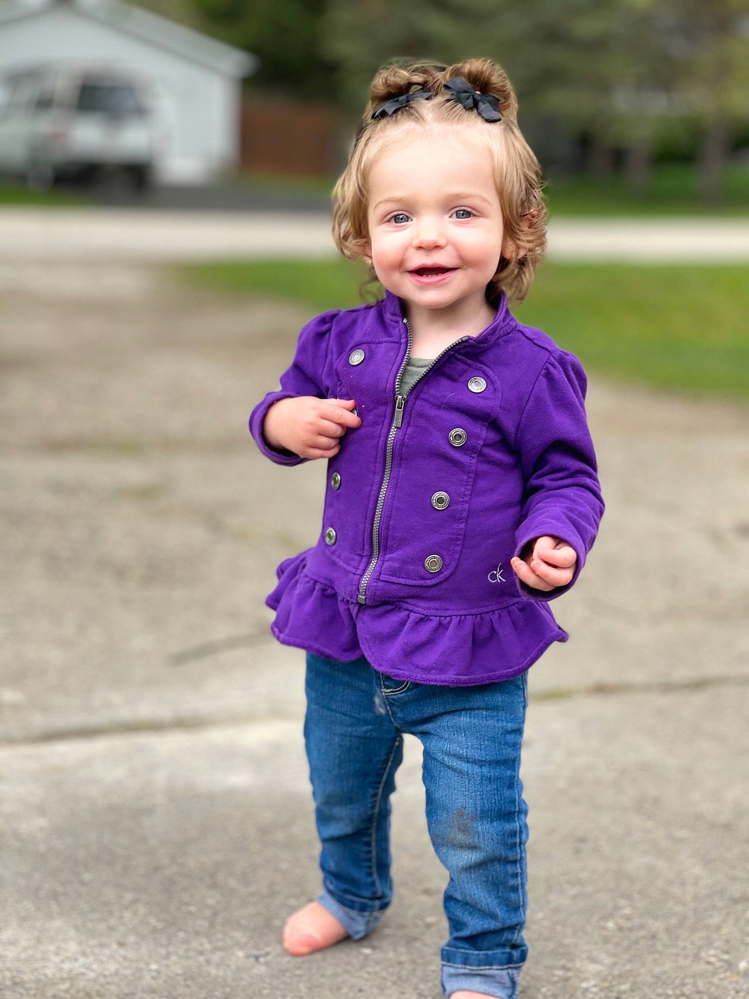 Hadley joined the competition — help win amazing prizes! baby_toddler_clothing, denim, face, gesture, grass, hair, happy, head, jeans, joy, leisure, people_in_nature, person, pink, plant, purple, shoulder, sleeve, smile, street_fashion