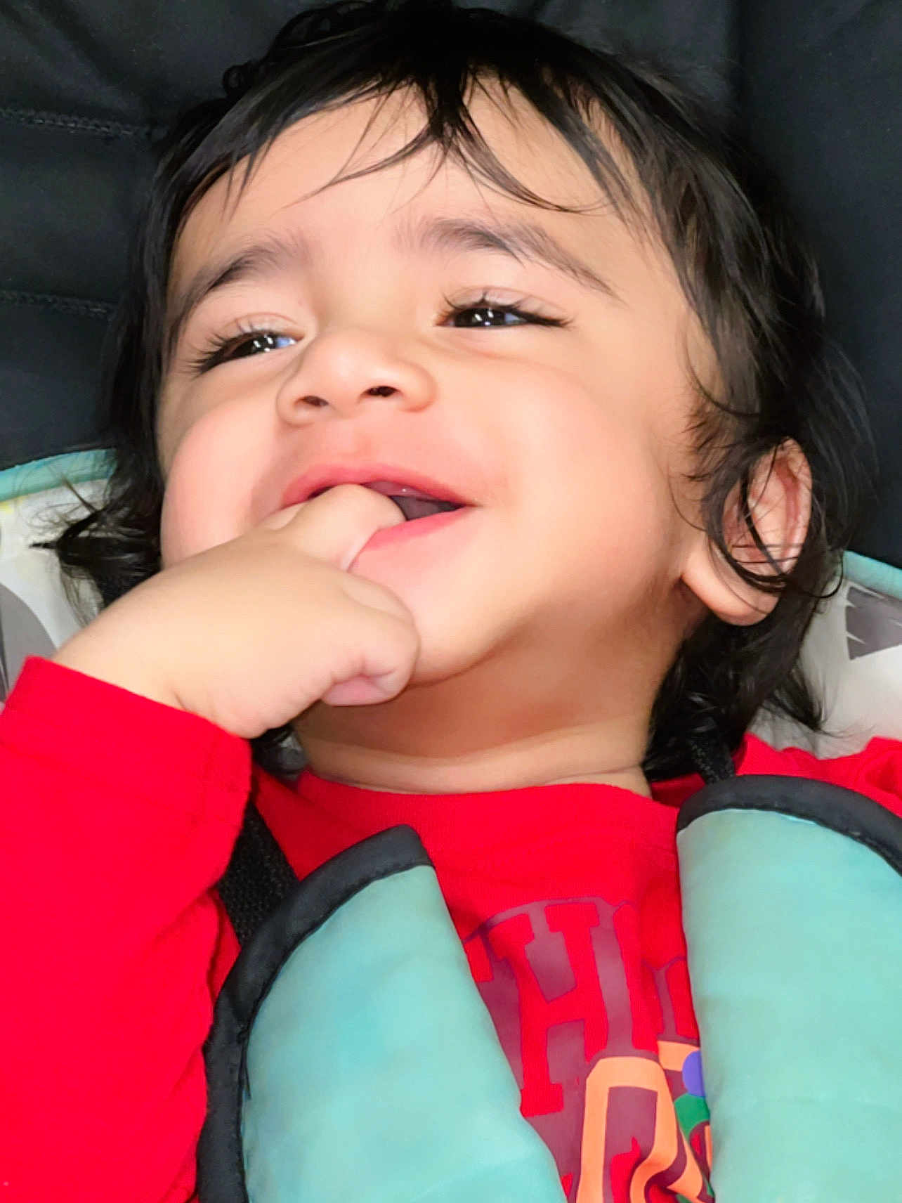 Badri joined the competition — help win amazing prizes! baby, cheerful, child, closeup, cute, eyes, face, hair, hand, happy, harness, indoors, laughing, person, portrait, red_shirt, seat, skin, smiling, toddler