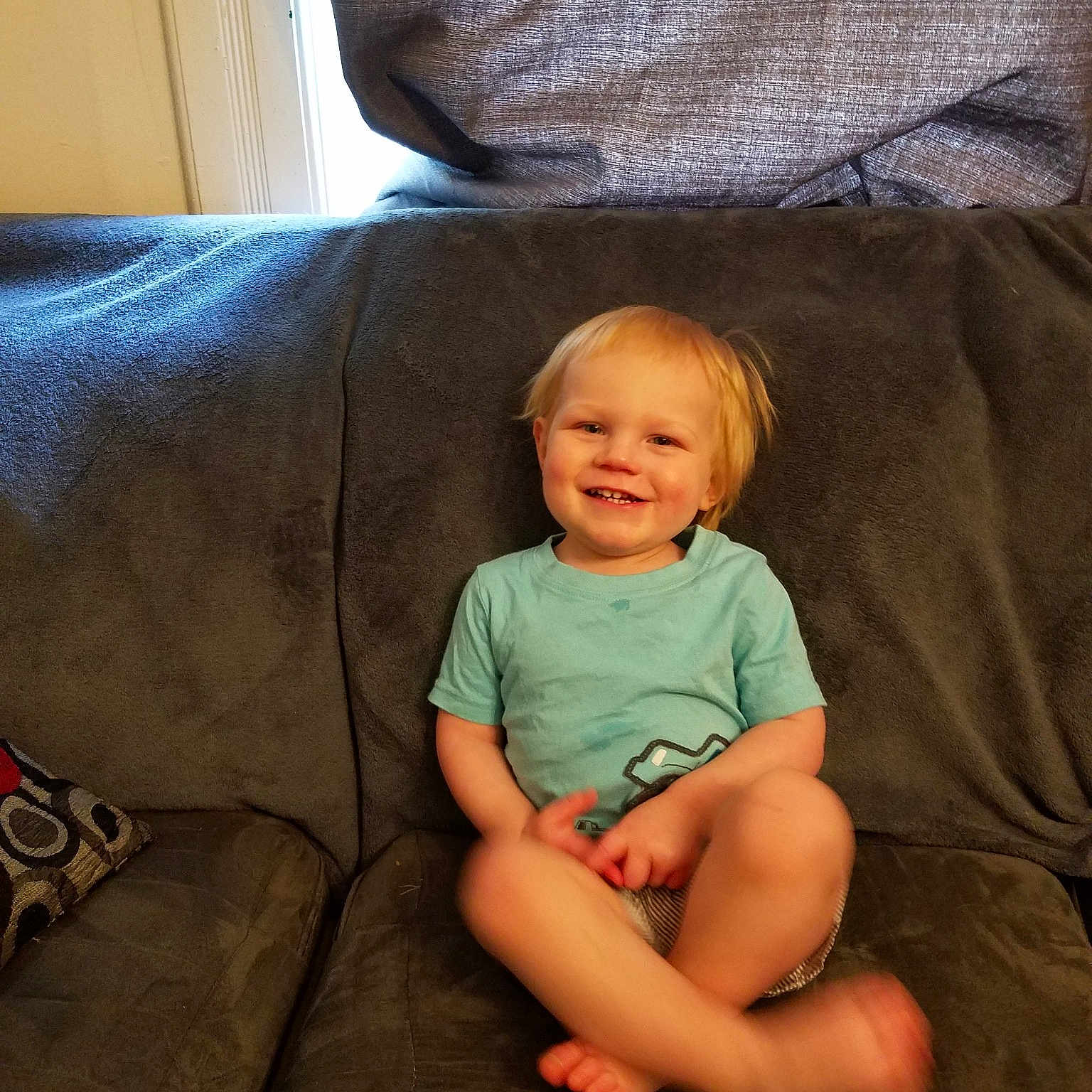 Nicholas joined the competition — help win amazing prizes! arm, baby, child, comfort, couch, furniture, joy, leg, person, sitting, toddler