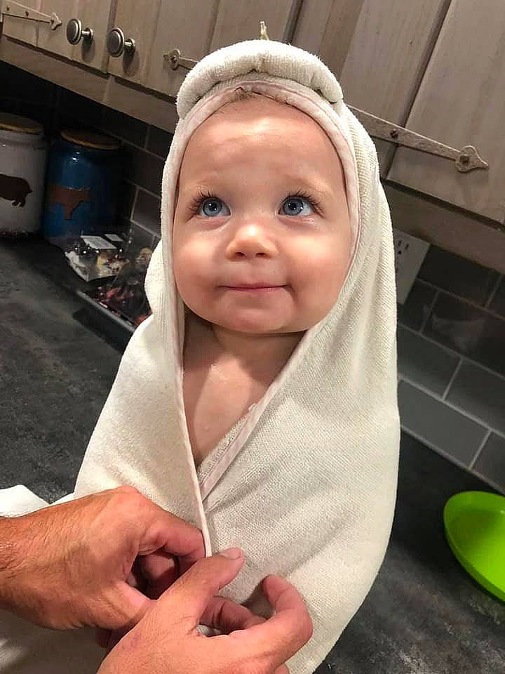 Sterling is registered to the contest to win money with this photo: baby, baby_safety, baby_toddler_clothing, cheek, child, comfort, face, fashion_accessory, finger, gesture, happy, lip, mouth, nail, person, service, skin, sleeve, smile, thumb