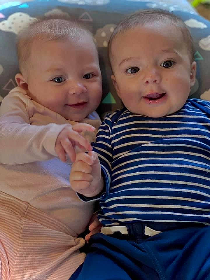 Sterling is registered to the contest to win money with this photo: baby_toddler_clothing, cheek, chin, eye, facial_expression, fun, gesture, hairstyle, happy, human, interaction, iris, mammal, nose, person, pink, product, skin, sleeve, smile