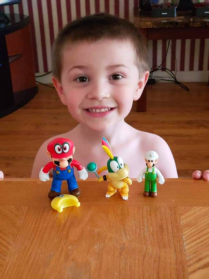 Evan is registered to the contest to win money with this photo: baby_toys, child, doll, facial_expression, finger, flooring, fun, happy, head, human_body, joy, lego, mammal, nose, people, person, play, smile, toddler, toy