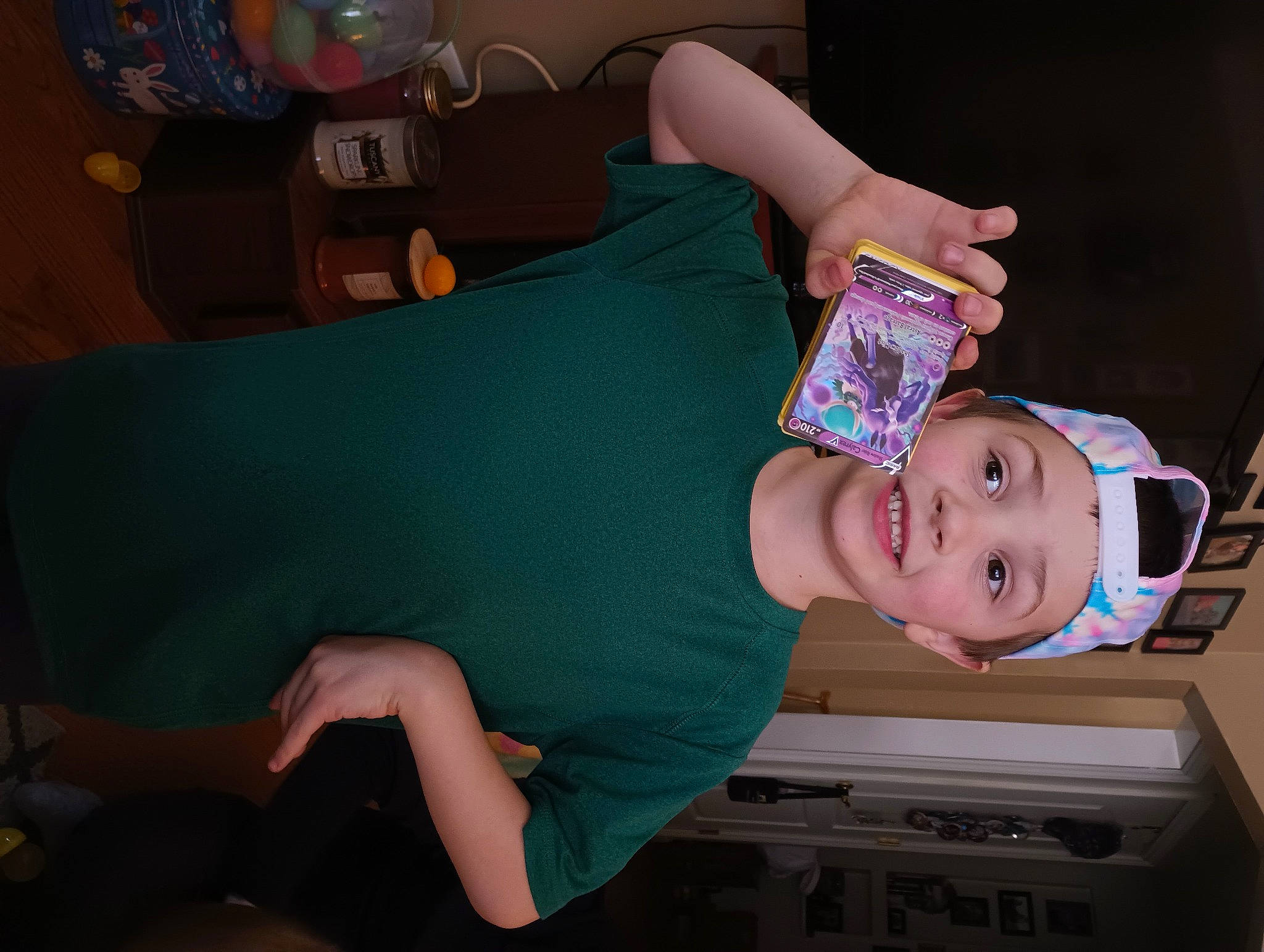 Evan is registered to the contest to win money with this photo: baby, baby_toddler_clothing, child, comfort, fun, happy, headwear, home_appliance, human_leg, joy, kitchen_appliance, knee, mouth, party, person, room, smile, t_shirt, thigh, toddler