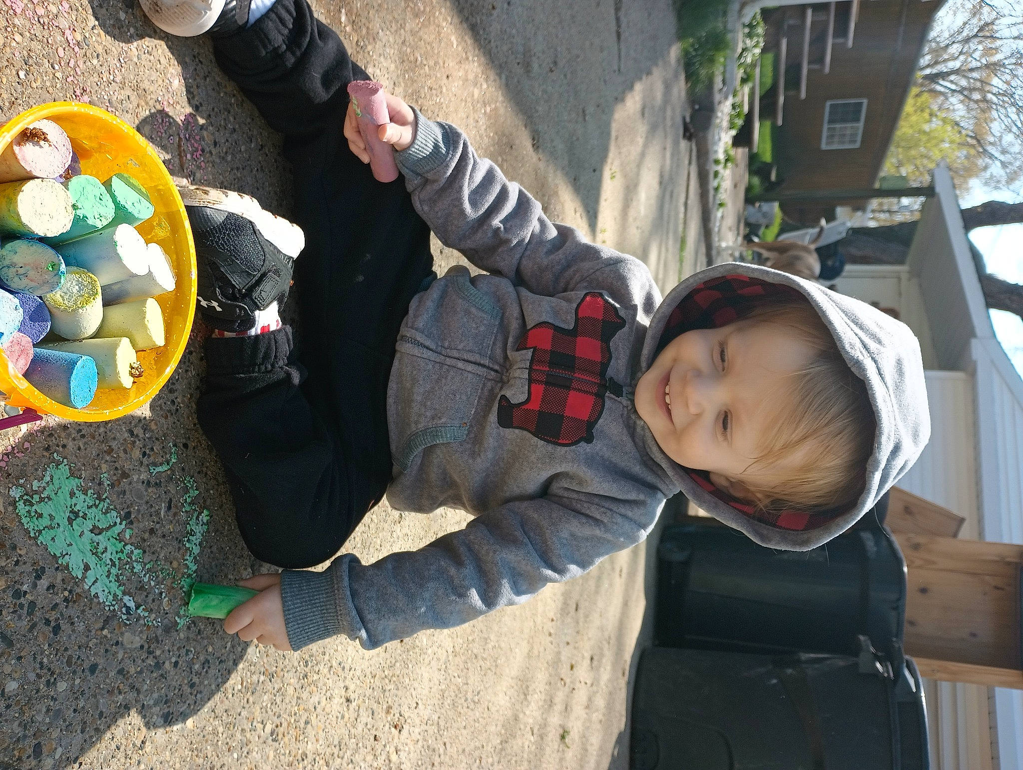 Carsyn is registered to the contest to win money with this photo: baby, child, fun, glove, grass, hoodie, human_settlement, jacket, joy, leisure, outerwear, person, plant, play, recreation, sitting, sneakers, toddler, tourism, travel