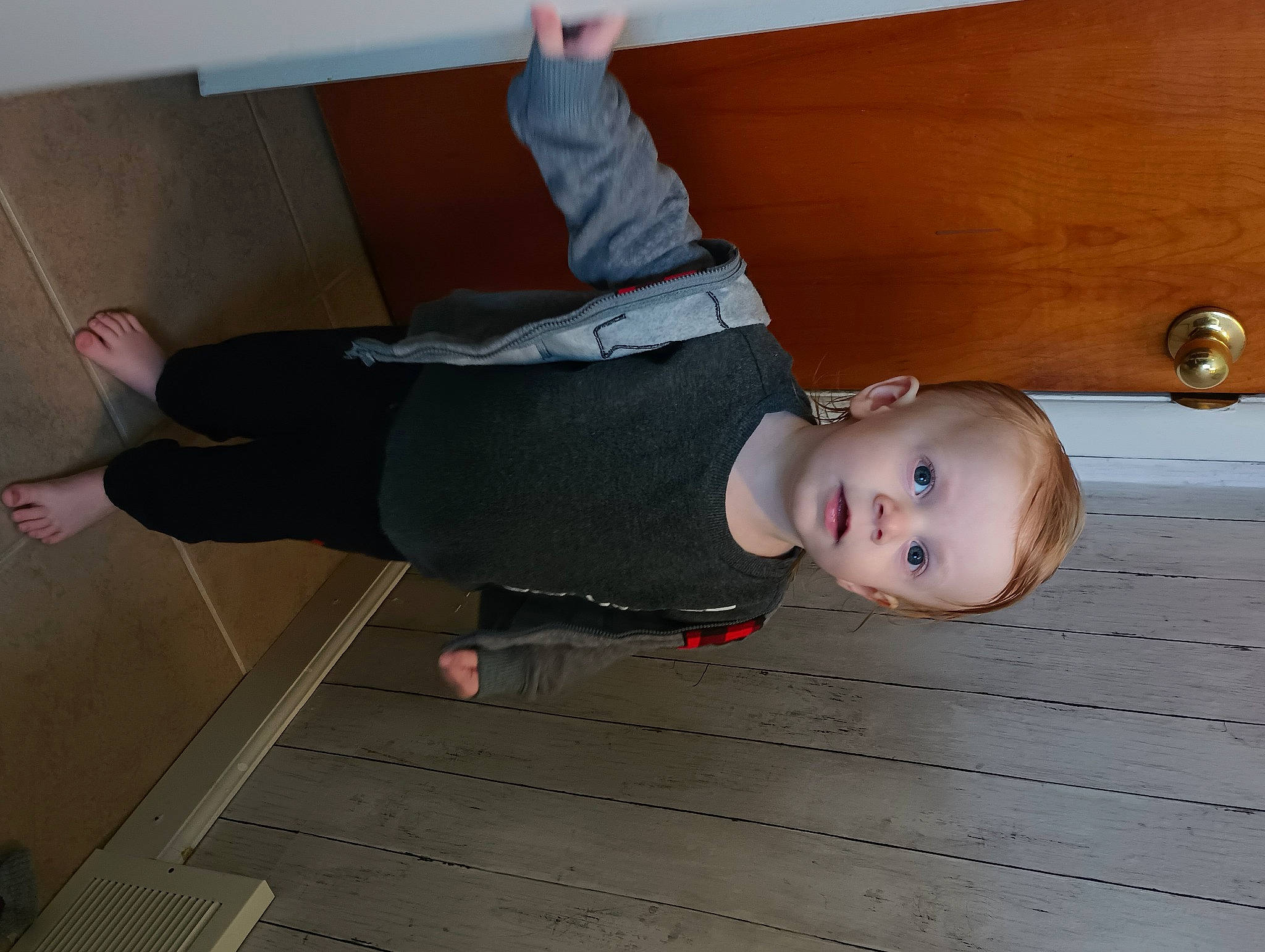 Carsyn is registered to the contest to win money with this photo: baby, baby_toddler_clothing, balance, ceiling, child, cleanliness, comfort, floor, flooring, fun, hardwood, human_leg, joint, knee, person, room, thigh, thumb, toddler, varnish