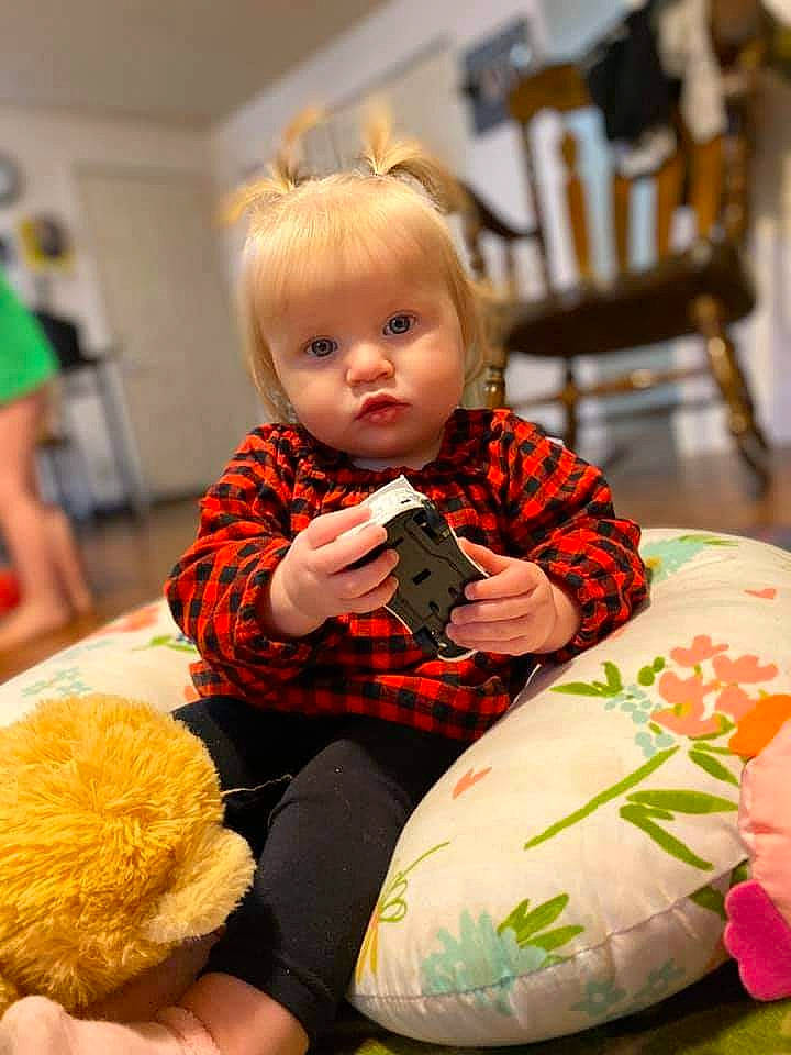 Oasis is registered to the contest to win money with this photo: baby, cheek, child, person, play, room, sitting, toddler, toy