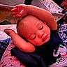 Ean joined the competition — help win amazing prizes! baby, infant, sleeping, sleepy, portrait, face, closed_eyes, curled_up, arms, hands, clothing, elephant_design, onesie, blanket, bed, indoor, close_up, resting, peaceful, adorable