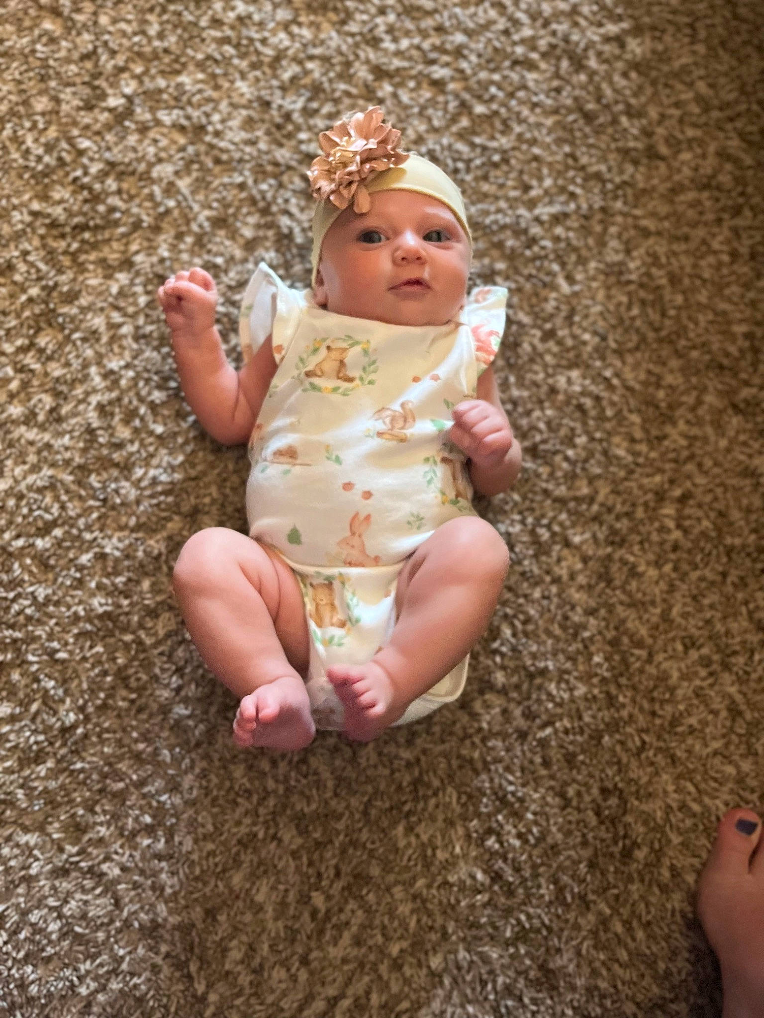 Ember is registered to the contest to win money with this photo: baby, baby_toddler_clothing, barefoot, dress, fawn, finger, foot, fun, grass, head, headwear, human_body, human_leg, leg, nail, people_in_nature, person, sand, sitting, thumb