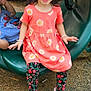 casual, child, clothing, daylight, dress, floral_leggings, footwear, fun, girl, green_play_equipment, happy, outdoor, person, pigtails, play, playground, slide, smiling, tunnel, white_shoes