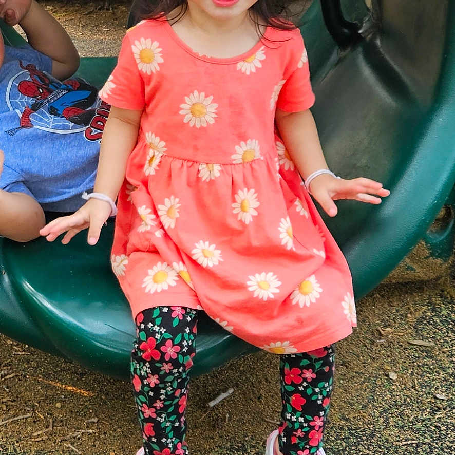 Liana joined the competition — help win amazing prizes! casual, child, clothing, daylight, dress, floral_leggings, footwear, fun, girl, green_play_equipment, happy, outdoor, person, pigtails, play, playground, slide, smiling, tunnel, white_shoes