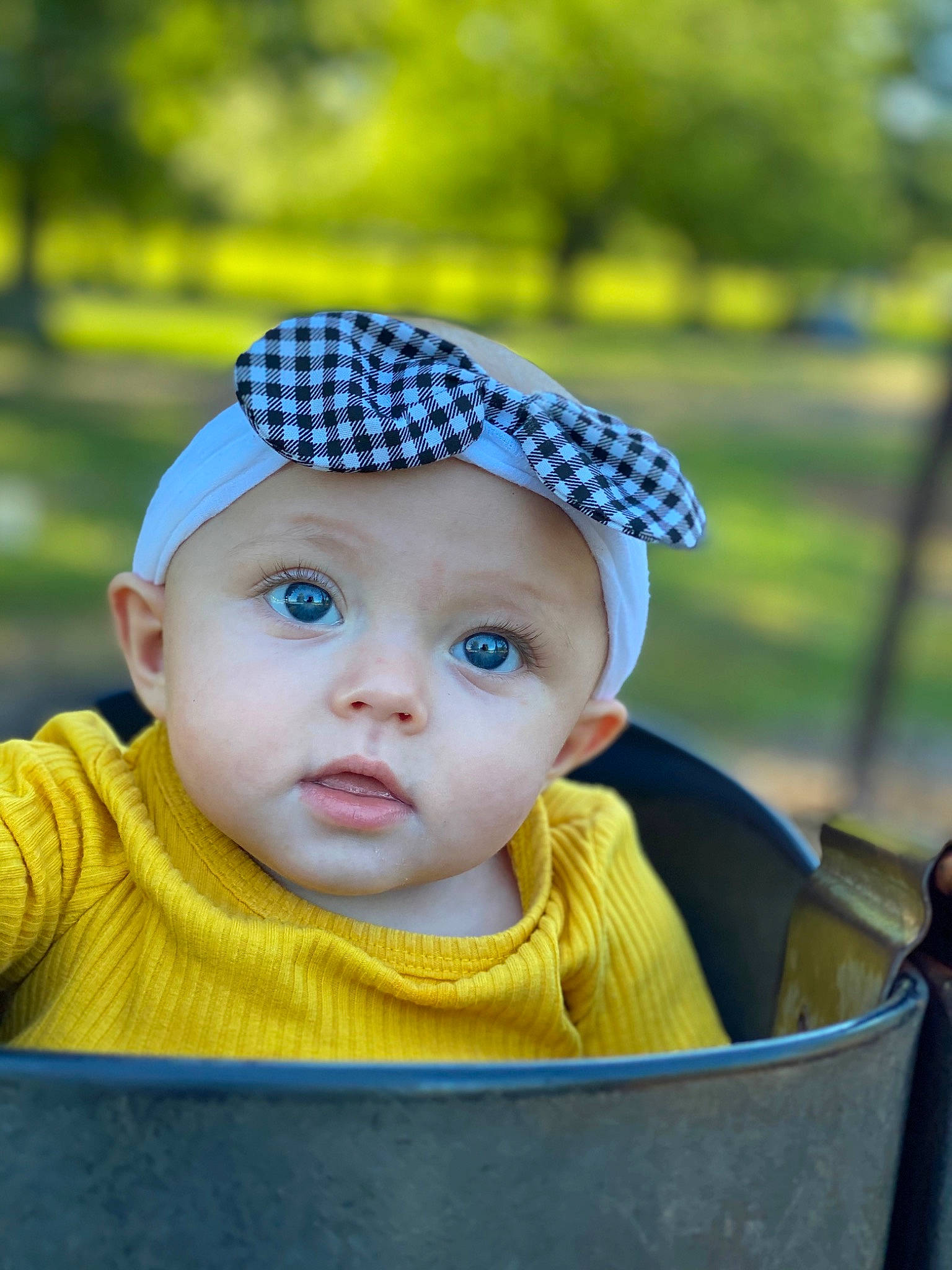 Excella is registered to the contest to win money with this photo: baby, baby_toddler_clothing, cap, chin, electric_blue, eye, fun, grass, hairstyle, happy, headgear, headwear, leisure, outerwear, people_in_nature, person, product, skin, standing, toddler