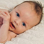 Theodore joined the competition — help win amazing prizes! baby, blanket, blue_eyes, child, closeup, cute, expression, face, hand, human, infant, lying_down, newborn, person, portrait, relaxing, skin, soft, white, young