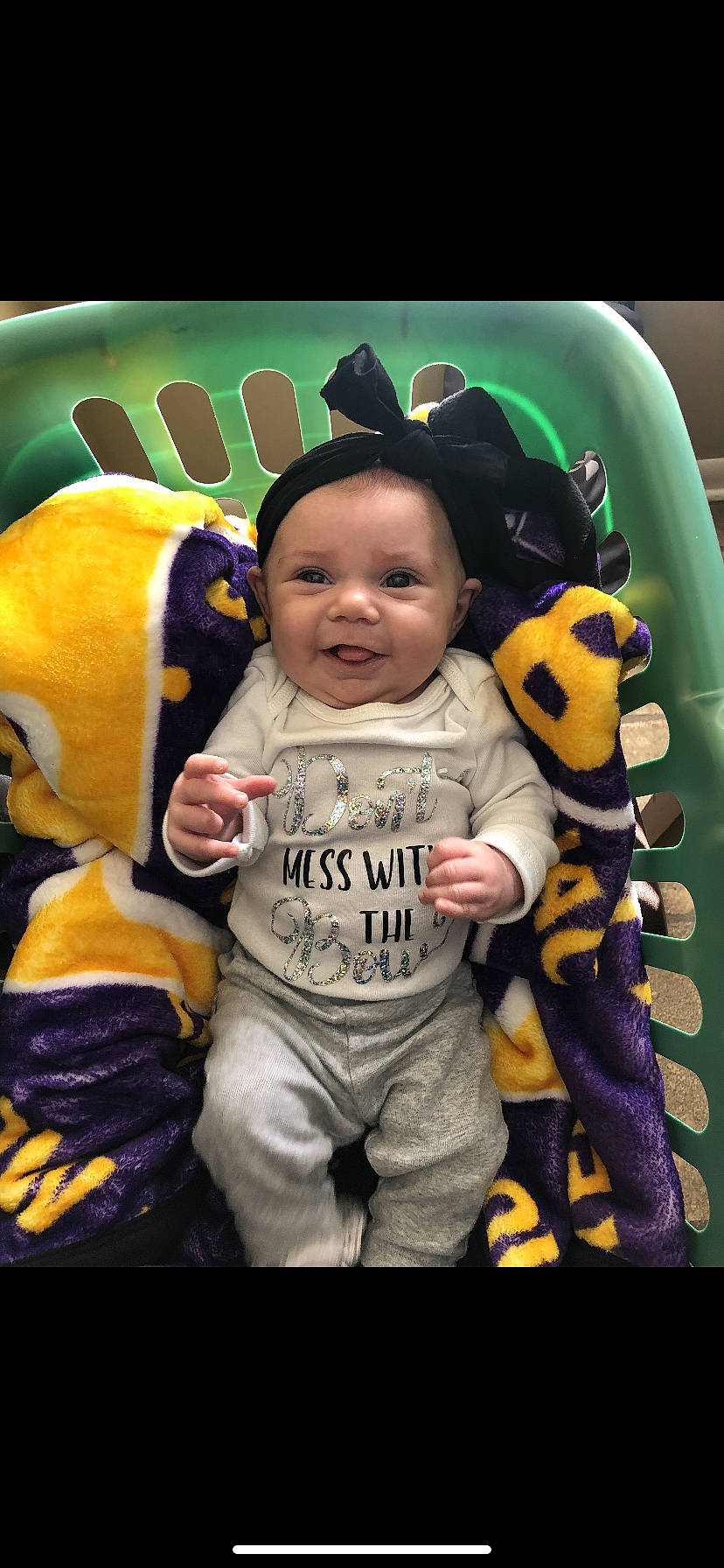 Maelynn is registered to the contest to win money with this photo: baby, baby_products, baby_toddler_clothing, child, cool, fun, happy, leisure, orange, outerwear, people, person, personal_protective_equipment, photo_caption, play, recreation, room, sleeve, smile, t_shirt