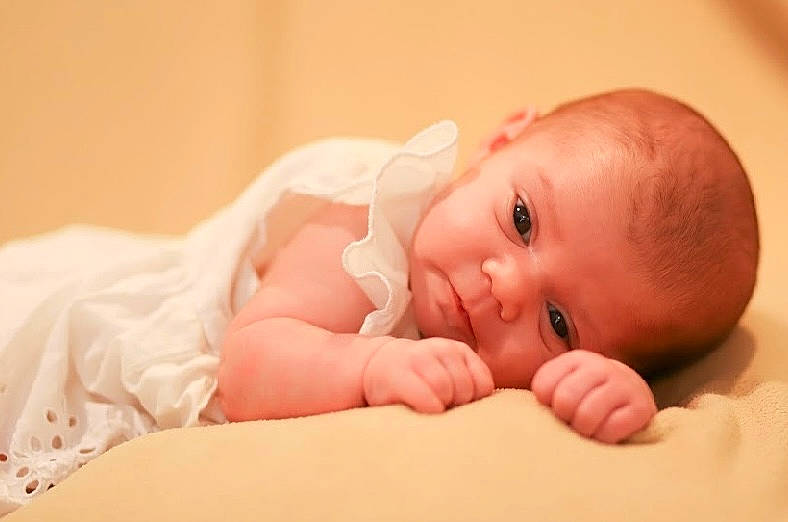 Maelynn is registered to the contest to win money with this photo: arm, baby, baby_toddler_clothing, cheek, comfort, eye, eyebrow, finger, flash_photography, flooring, fun, gesture, happy, human_body, iris, lip, mouth, nail, person, thumb