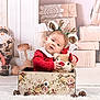 Willow a rejoint le concours — aidez-le/la à gagner de superbes lots ! carpet, child, christmas, cozy, cute, drawer, festive, floral_pattern, gift_boxes, holiday, indoor, lace, pinecones, plush_toy, portrait, red_sweater, reindeer_antlers, santa_figurine, smiling, toddler