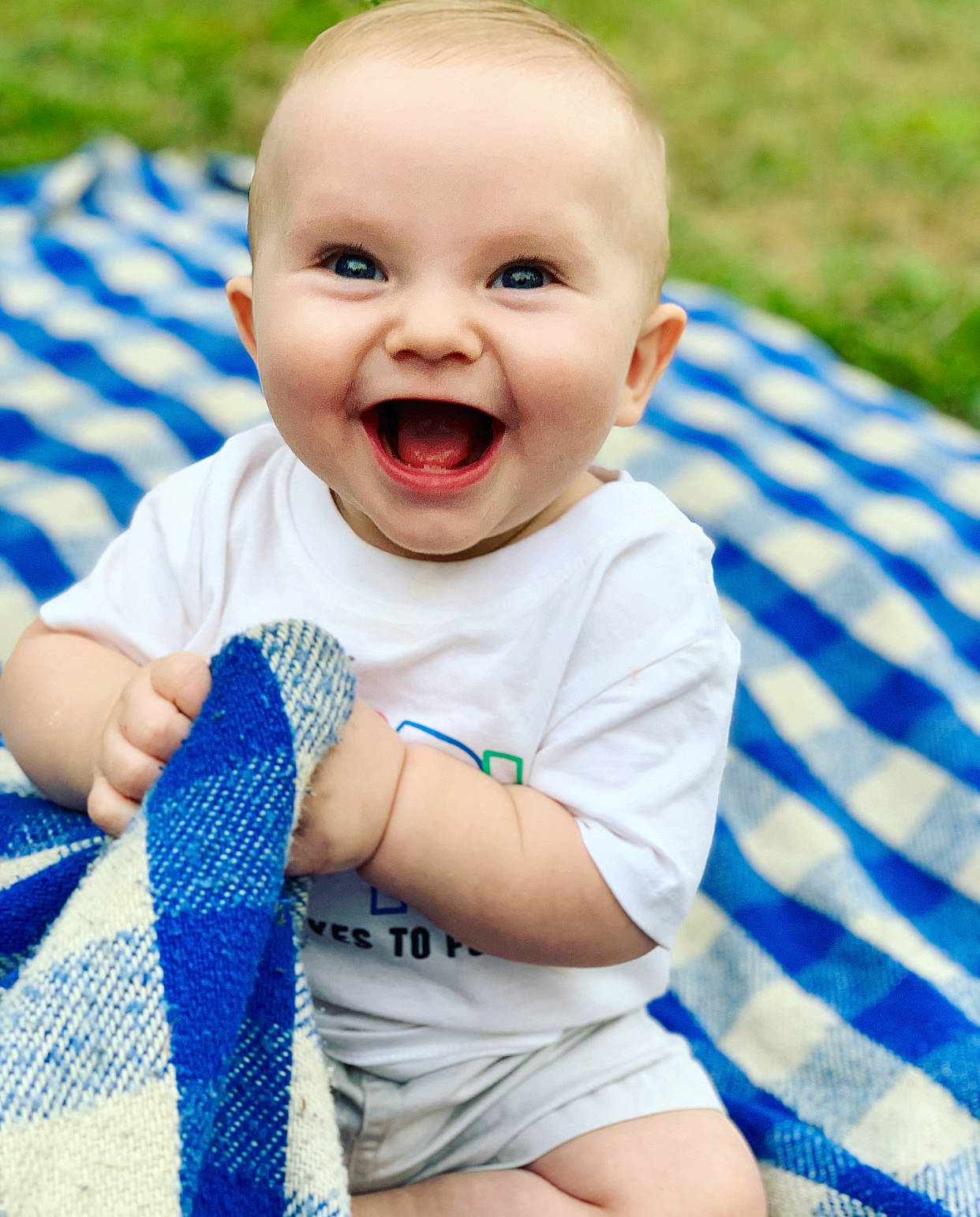 Richie joined the competition — help win amazing prizes! baby, baby_toddler_clothing, blue, cheek, child, design, eye, face, facial_expression, grass, happy, head, laugh, male, pattern, person, plaid, skin, smile, summer
