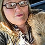 Lucky is registered to the contest to win money with this photo: woman, glasses, dog, pet, portrait, indoor, closeup, casual, light, reflection, blurry, hair, clothing, face, smile, holding, animal, companion, warm, friendly