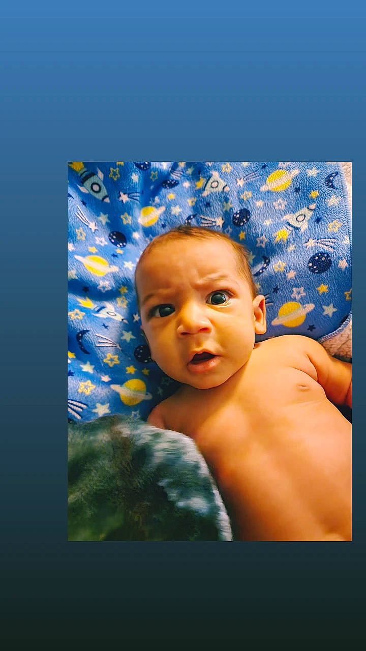 Jakobi is registered to the contest to win money with this photo: art, azure, baby, barechested, blue, cheek, chest, child, chin, electric_blue, flash_photography, fun, happy, pattern, person, portrait, portrait_photography, room, thumb, toddler