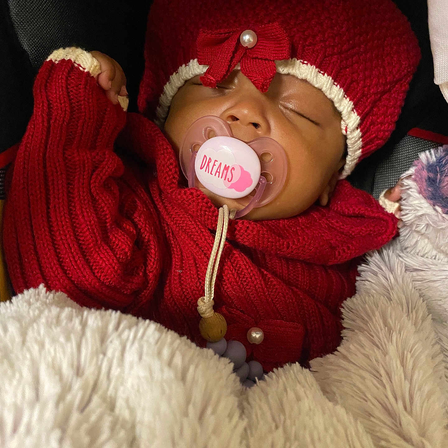 Jalayah joined the competition — help win amazing prizes! baby, blanket, bonnet, cap, clothing, coat, couch, face, furniture, glove, hat, head, jacket, knitwear, person, photography, portrait, sleeping, sweater, yawning