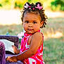 Layana a rejoint le concours — aidez-le/la à gagner de superbes lots ! book, butterfly_clips, child, curly_hair, cute, daylight, grass, hair_clips, nature, outdoor, person, pink_dress, playful, portrait, purple_chair, reading, smiling, summer, toddler, young_child