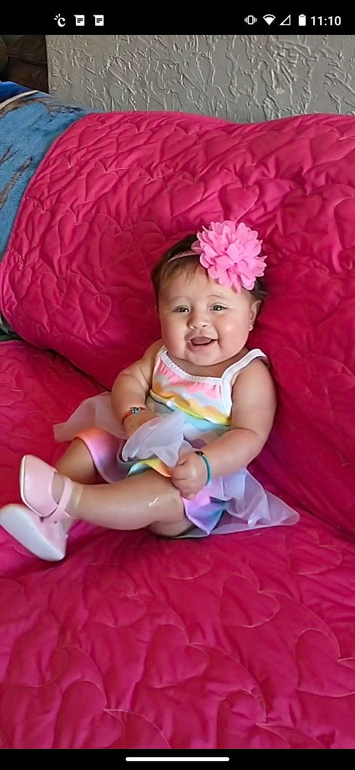 Leona joined the competition — help win amazing prizes! baby, baby_toddler_clothing, child, comfort, facial_expression, fashion_accessory, flash_photography, fun, grass, happy, human_leg, magenta, person, petal, pink, purple, sitting, skin, smile, textile