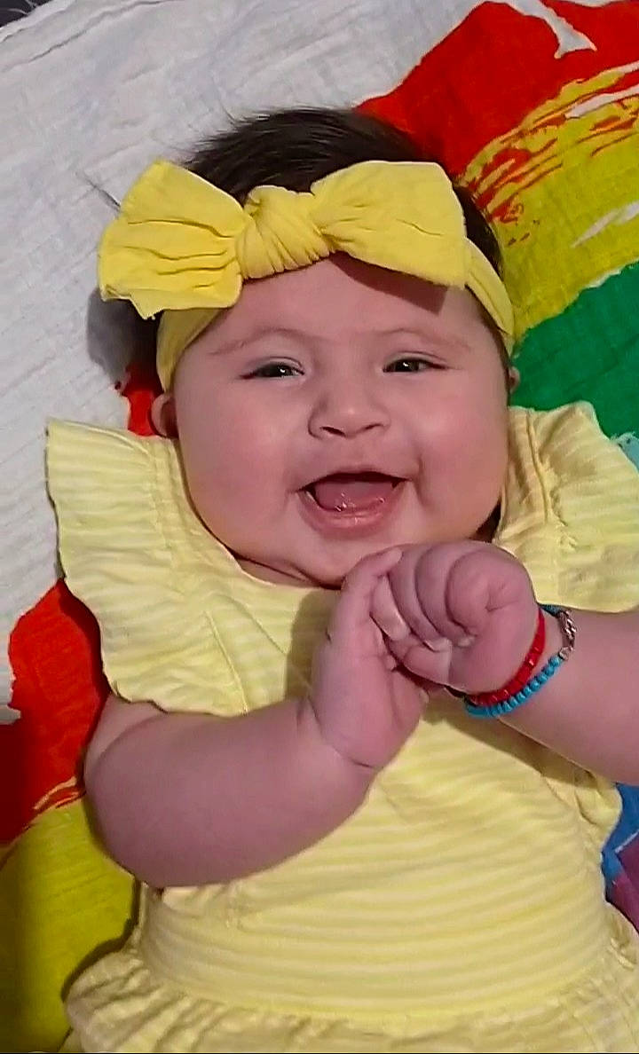 Leona is registered to the contest to win money with this photo: baby, baby_laughing, baby_toddler_clothing, cheek, child, event, face, fashion_accessory, fun, gesture, happy, headwear, laugh, leisure, lip, mouth, person, pink, playing_with_kids, smile