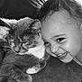 child, cat, smiling, happy, cute, pet, animal, friendship, cozy, indoor, black_and_white, portrait, face, fur, eyes_closed, person, toddler, clothing, cuddle, resting
