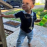 Elijahh is registered to the contest to win money with this photo: toddler, child, outdoor, porch, green_sippy_cup, pacifier, jeans, boots, navy_polo, curly_hair, black_suv, driveway, chalk_drawings, wooden_post, sunny, side_view, grass, concrete, hand_holding, expression