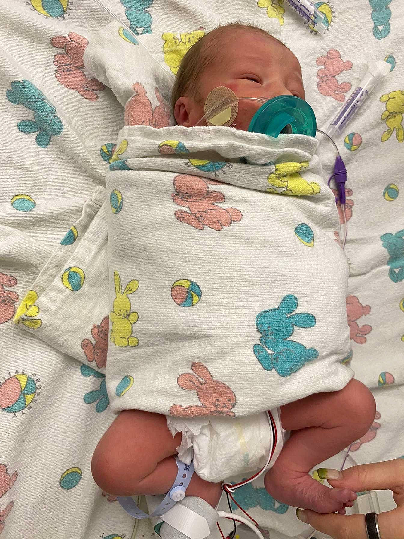 Glenn is registered to the contest to win money with this photo: art, baby, baby_products, baby_safety, baby_sleeping, baby_toddler_clothing, bedding, bedtime, child, comfort, linens, nail, pattern, person, play, product, room, skin, textile, thumb