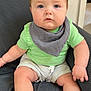 baby, child, infant, blue_eyes, green_shirt, gray_bib, shorts, sitting, chair, indoor, cute, skin, face, legs, feet, expression, portrait, young, comfortable, texture