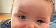 Jameson is registered to the contest to win money with this photo: baby, blue_eyes, cheeks, child, childhood, close_up, cute, expression, face, happy, head, indoor, infant, person, portrait, skin, smiling, sweater, warm, young