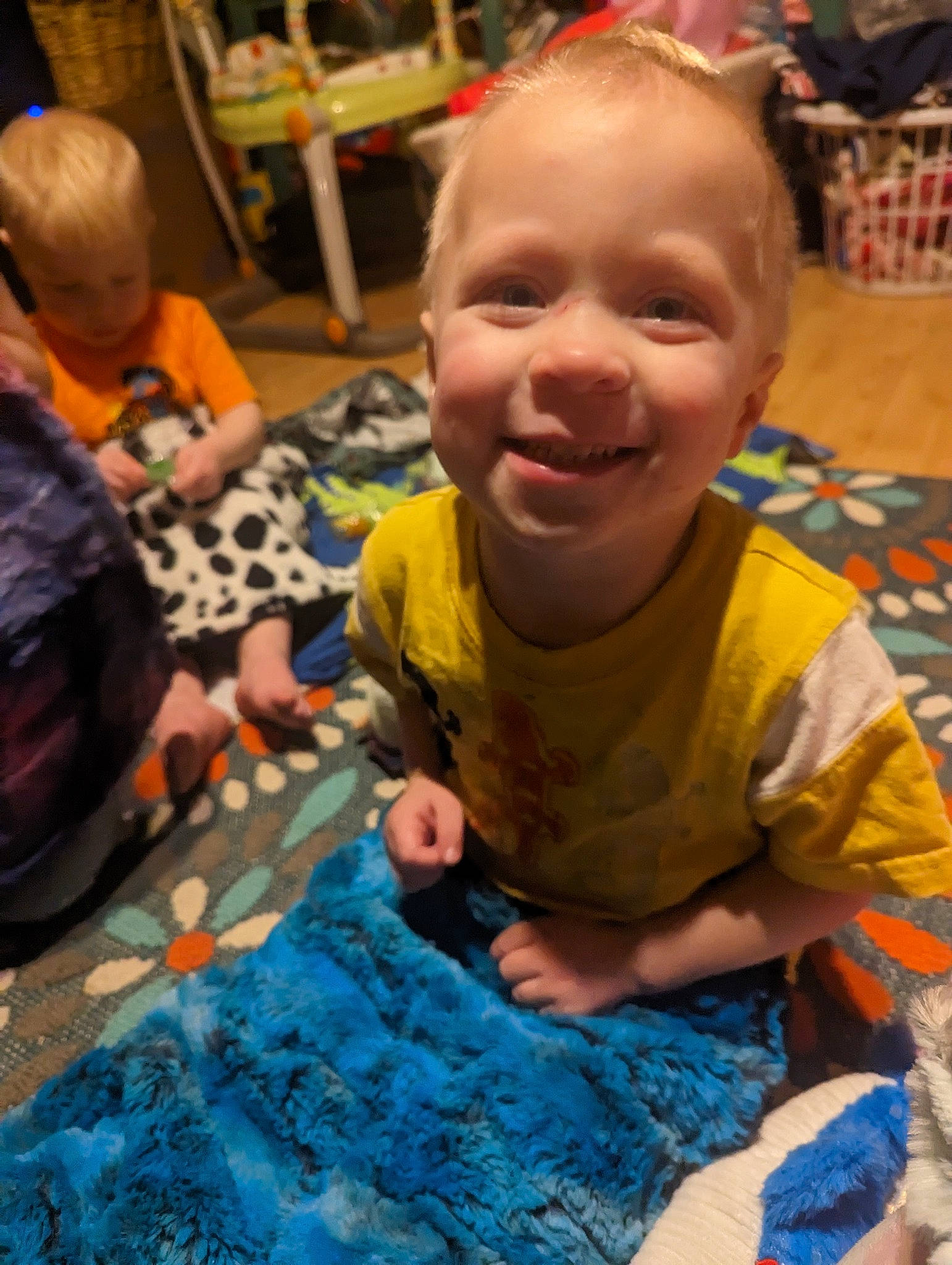 Denny is registered to the contest to win money with this photo: adaptation, baby, bag, chair, child, event, flooring, fun, happy, head, joy, leisure, luggage_and_bags, person, play, sharing, sitting, smile, t_shirt, toddler