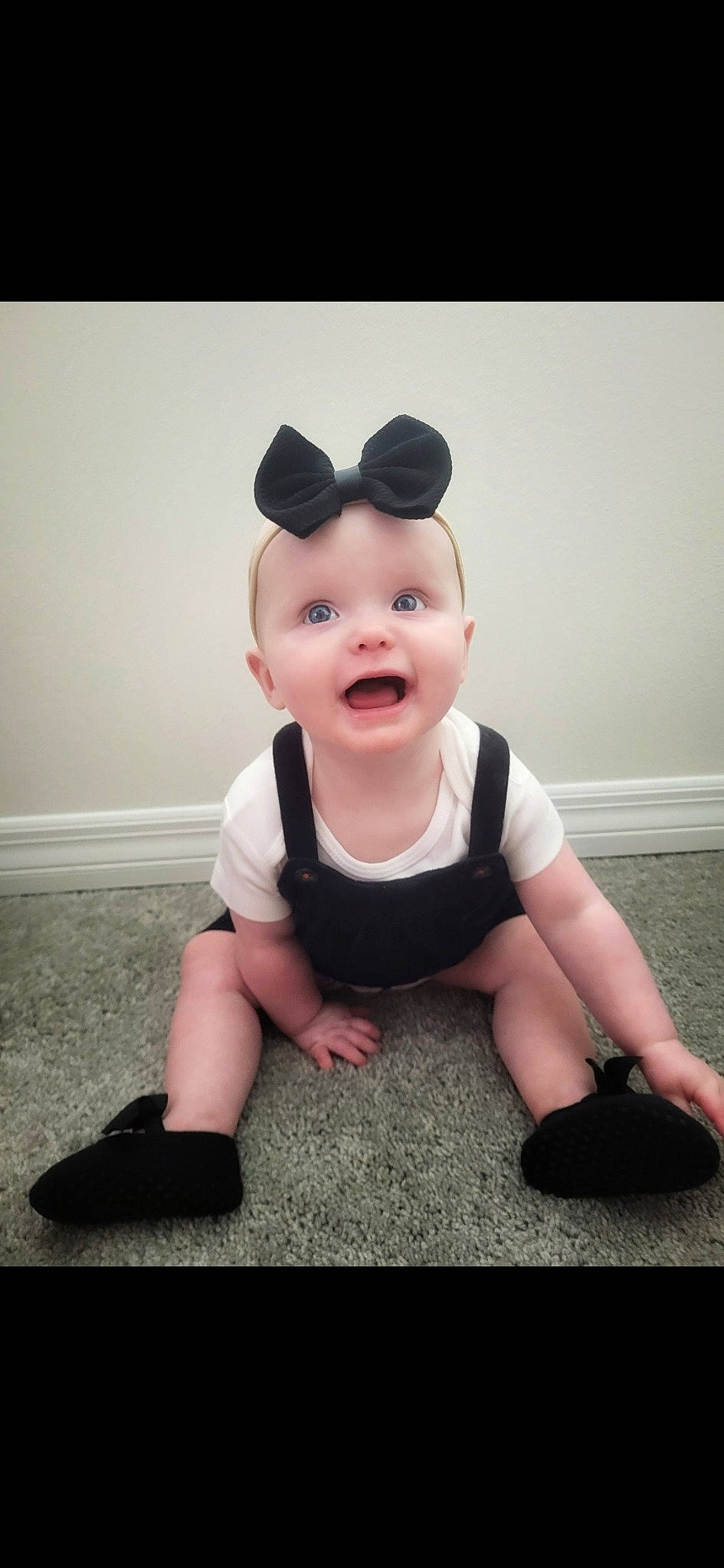 Riley joined the competition — help win amazing prizes! baby, baby_toddler_clothing, cheek, elbow, face, flash_photography, flooring, fun, happy, head, human_leg, knee, neck, pattern, person, sitting, sleeve, smile, surprise, t_shirt