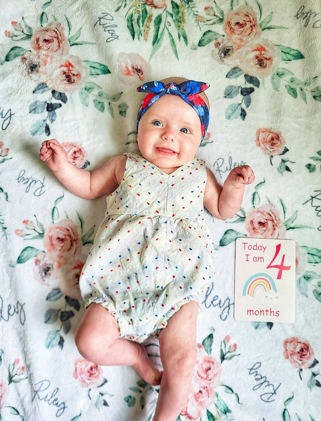 Riley is registered to the contest to win money with this photo: aqua, baby, baby_toddler_clothing, child, day_dress, dress, eye, fashion_accessory, happy, headband, headpiece, headwear, joy, magenta, pattern, person, pink, product, skin, sleeve