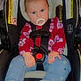 Paisley joined the competition — help win amazing prizes! baby, blue_jeans, car_seat, child, clothing, cute, face, feet, hair, hands, indoor, infant, pacifier, pony_tail, red_top, seatbelt, sitting, socks, toy_brush, warning_label