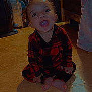 Dominic joined the competition — help win amazing prizes! toddler, child, plaid_pajamas, sitting, wooden_floor, indoors, mouth_open, happy, person, barefoot, bed, blanket, mirror, furniture, shadow, room, clothing, floor, smile, cute