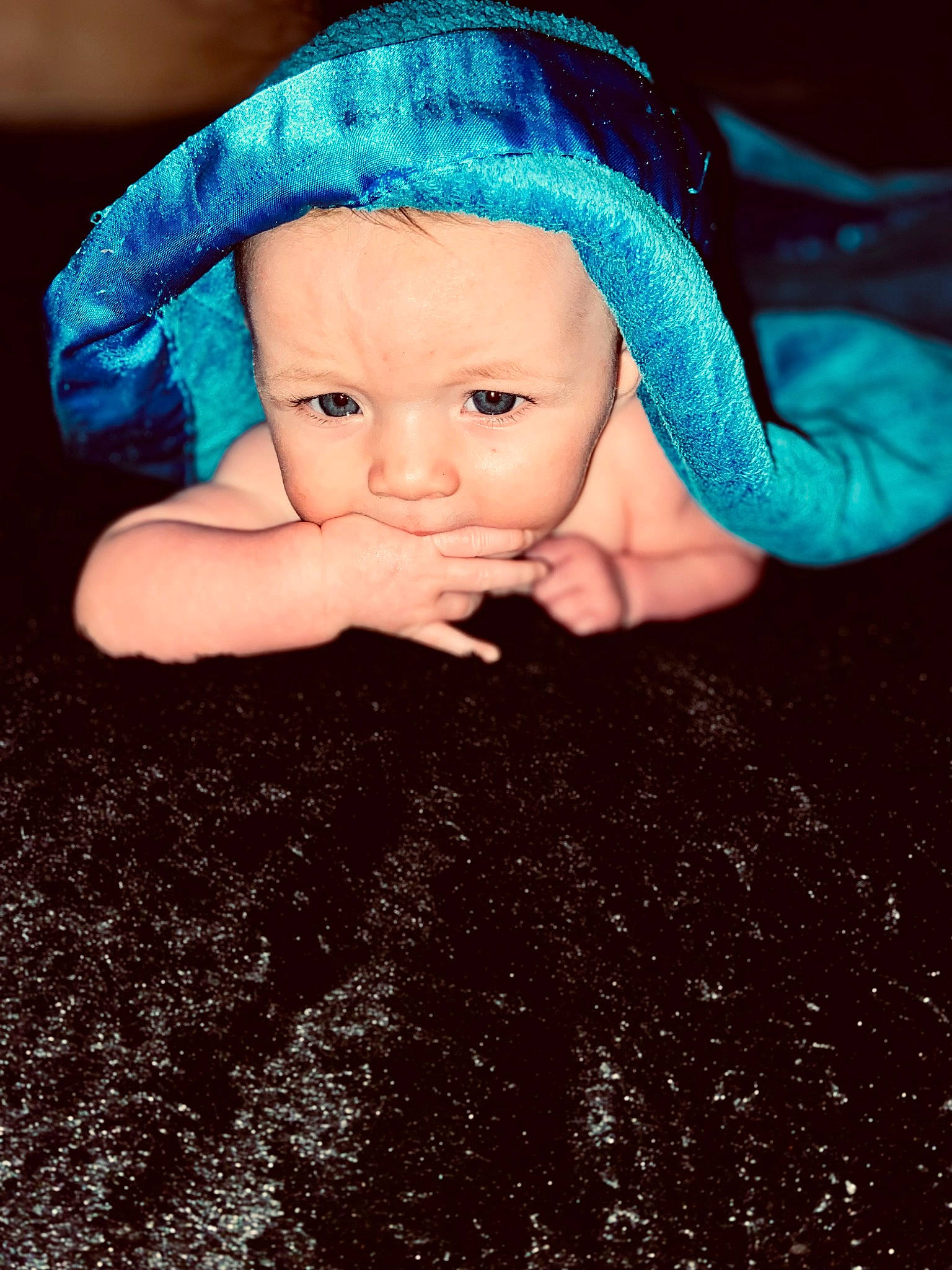 Remington joined the competition — help win amazing prizes! baby, baby_toddler_clothing, cap, child, close_up, costume_hat, doll, electric_blue, eye, flooring, grass, hand, headgear, knit_cap, person, skin, thumb, toddler, toy, wool