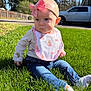 baby, infant, child, headband, bow, bib, jeans, socks, grass, outdoors, sunlight, portrait, sitting, expression, cute, lawn, trees, fence, vehicle, daytime
