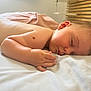 baby, sleeping, diaper, bed, blanket, skin, hand, face, peaceful, infant, rest, indoor, soft_light, closeup, newborn, toddler, cute, relaxation, child, portrait
