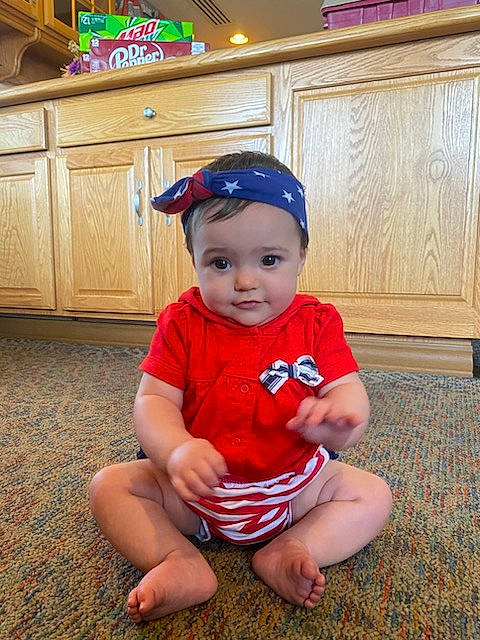 Prayla is registered to the contest to win money with this photo: baby, baby_toddler_clothing, baseball_cap, cabinetry, cap, child, costume_hat, floor, flooring, foot, happy, hat, headwear, human_leg, knee, person, sleeve, smile, standing, thigh