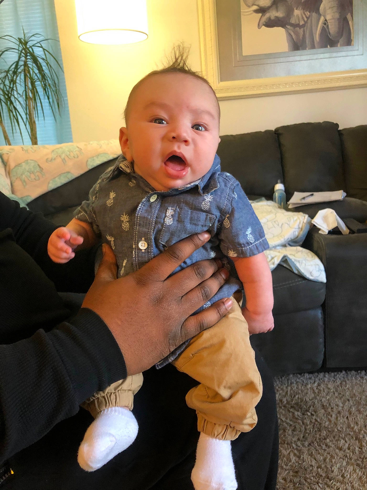 Malikai is registered to the contest to win money with this photo: arm, baby, child, finger, head, joint, leg, person, room, sitting, skin, surprise, thumb, toddler