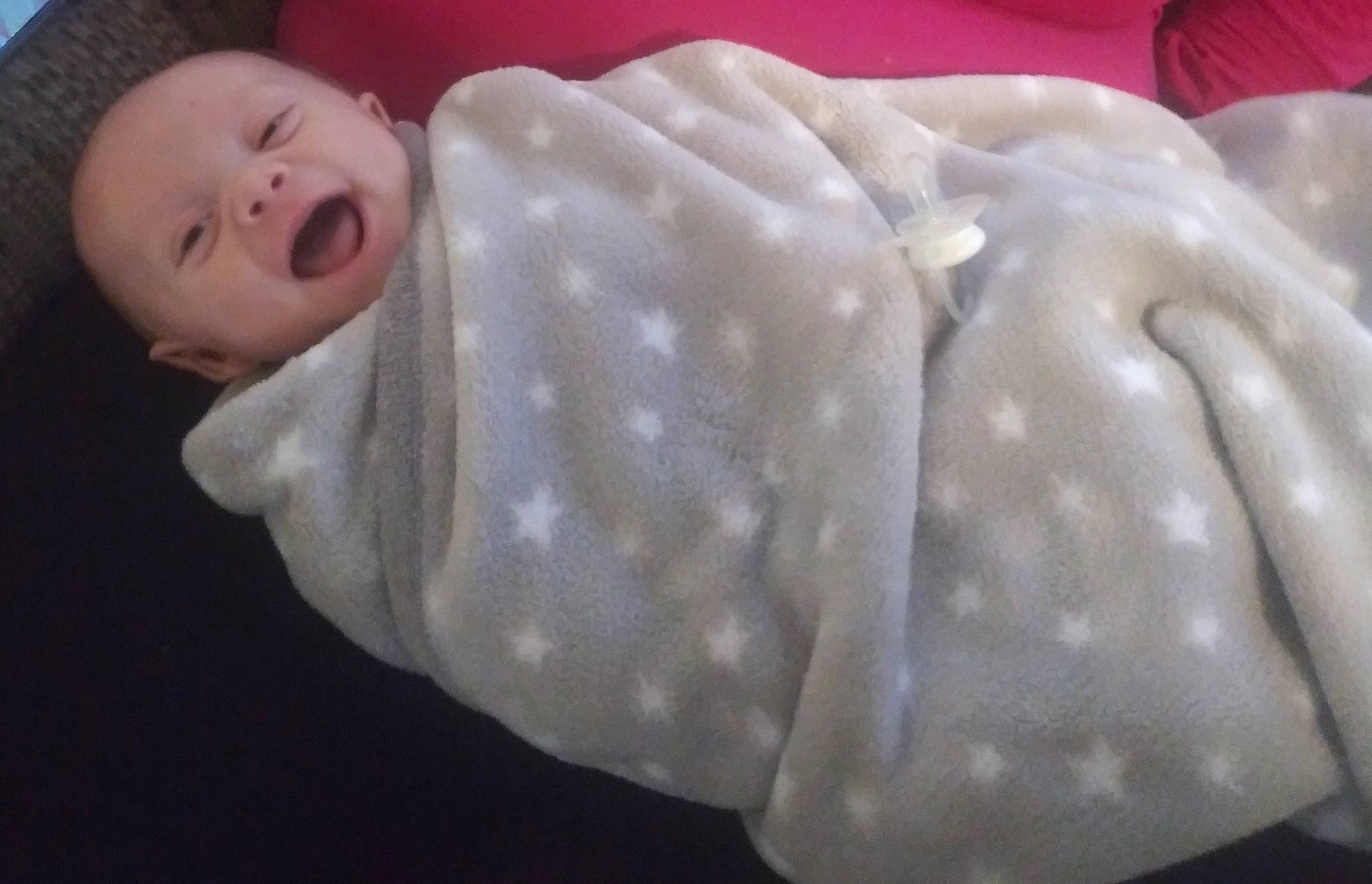 Gavin is registered to the contest to win money with this photo: baby, baby_products, baby_toddler_clothing, child, comfort_food, cuisine, dish, fashion_accessory, ingredient, linens, pattern, person, sleeve, smile, toddler