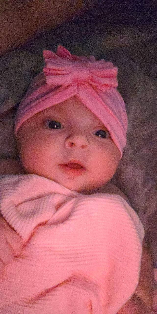 Phoebe is registered to the contest to win money with this photo: art, baby, baby_toddler_clothing, cap, cheek, chin, creative_arts, dress, eyebrow, face, facial_expression, headwear, helmet, lip, magenta, nose, person, pink, skin, sleeve