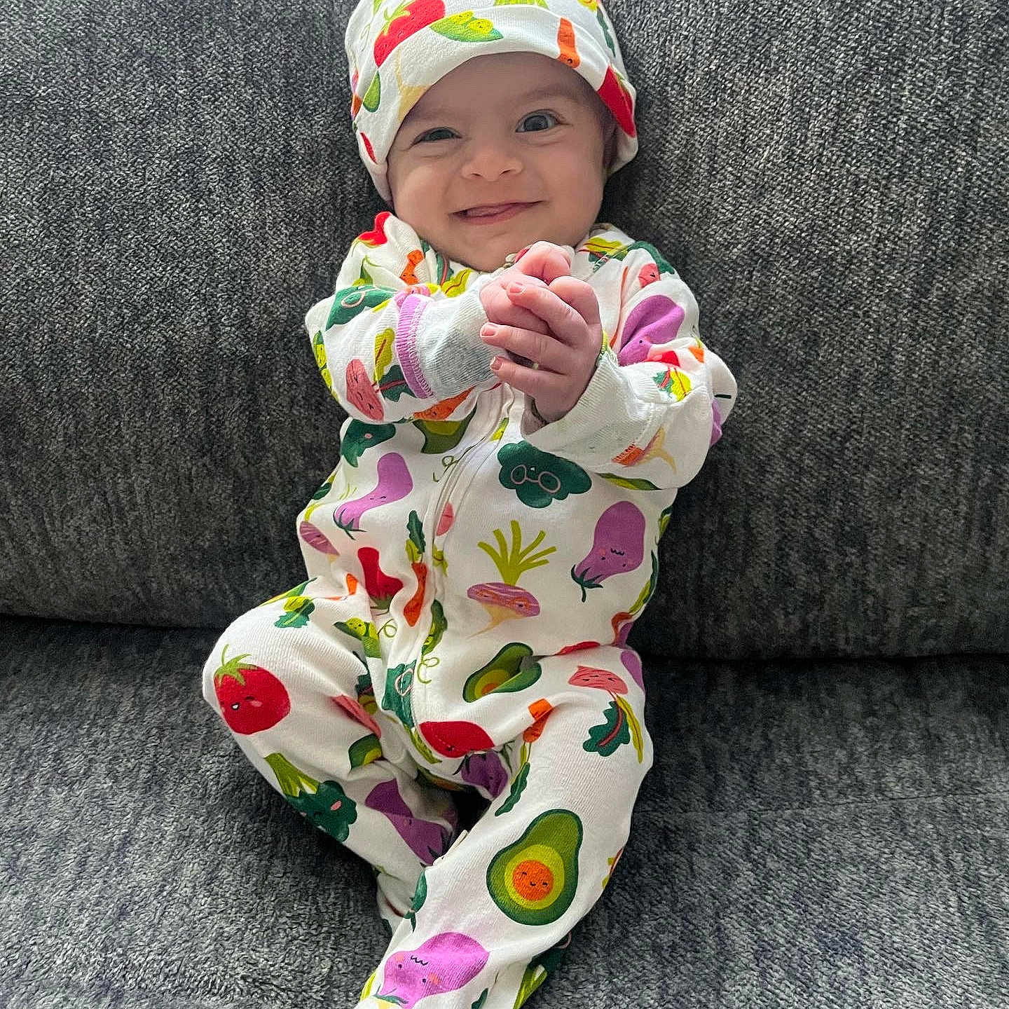 Luciano joined the competition — help win amazing prizes! baby, bodypart, bonnet, cap, clothing, face, finger, formalwear, hand, happy, hat, head, newborn, pajamas, person, photography, portrait, sitting, smile, suit