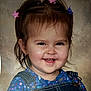 toddler, child, smile, happy, face, hair_clips, denim_overalls, floral_shirt, portrait, cute, young_child, studio, background, clothing, person, baby, head, cheerful, expression, closeup