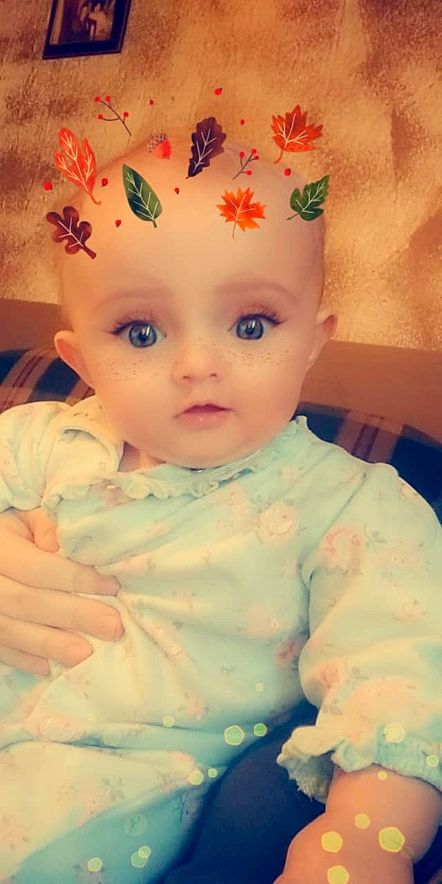 Lacie is registered to the contest to win money with this photo: cheek, child, doll, ear, eye, face, forehead, girl, hair_accessory, head, human_hair_color, infant, iris, lip, mouth, nose, organ, person, pink, skin