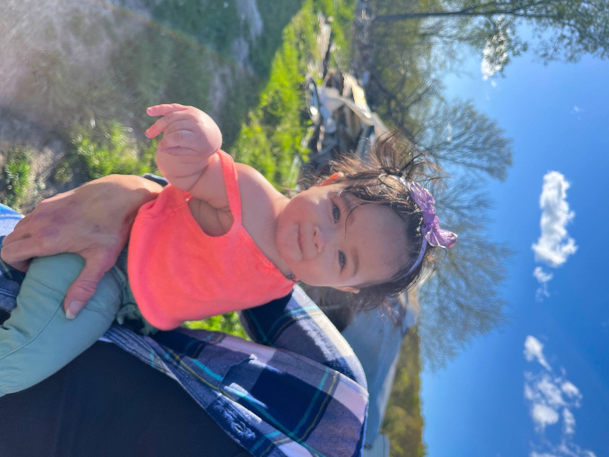 Elizabeth is registered to the contest to win money with this photo: adventure, cloud, electric_blue, eyewear, flash_photography, fun, grass, happy, lake, landscape, leisure, people_in_nature, person, plant, recreation, sky, smile, travel, tree, vacation