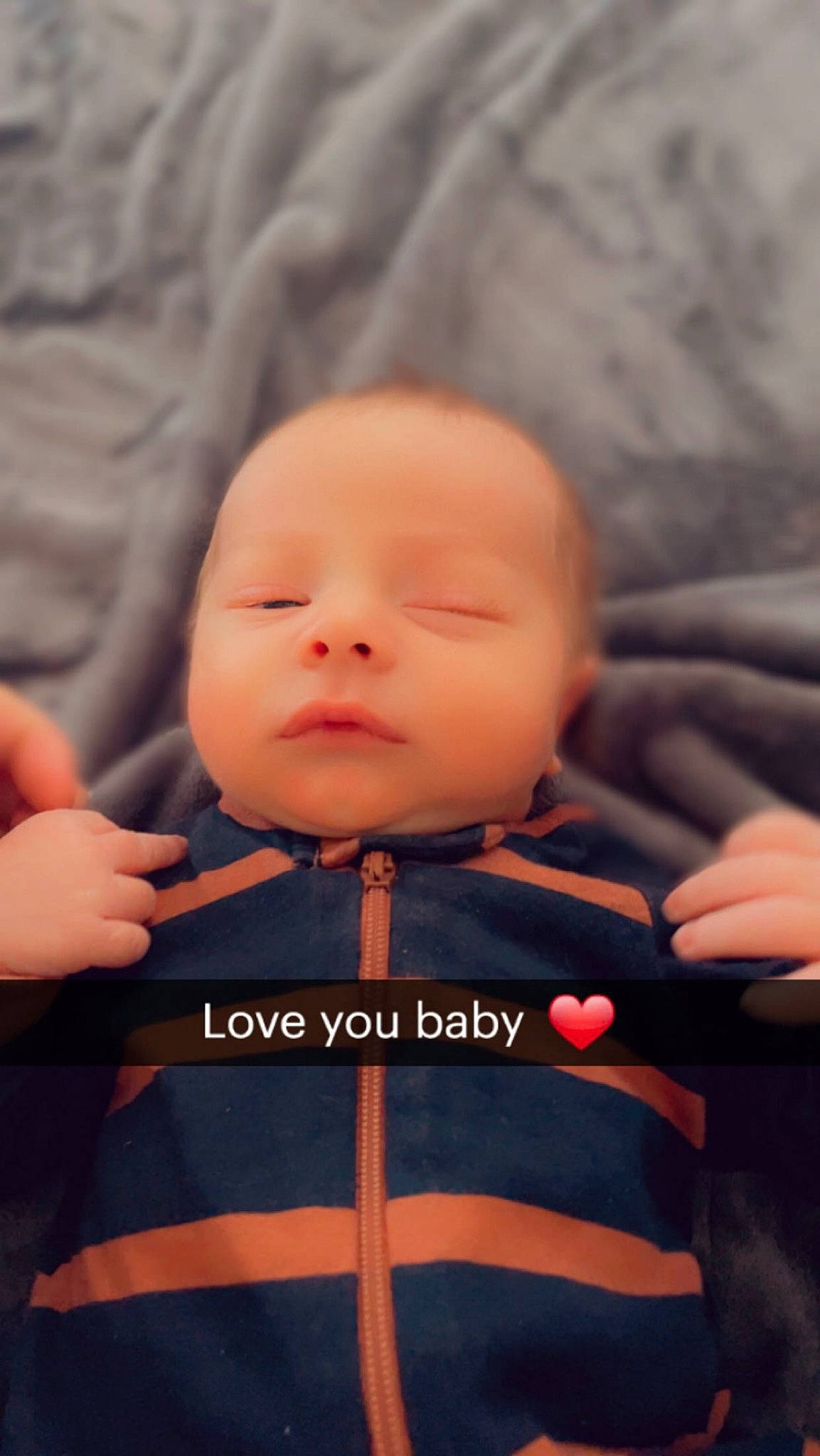 Arthur is registered to the contest to win money with this photo: baby, baby_carriage, baby_products, baby_toddler_clothing, child, collar, comfort, electric_blue, face, fun, gesture, happy, human_body, nail, pattern, person, sitting, sleeve, t_shirt, thumb