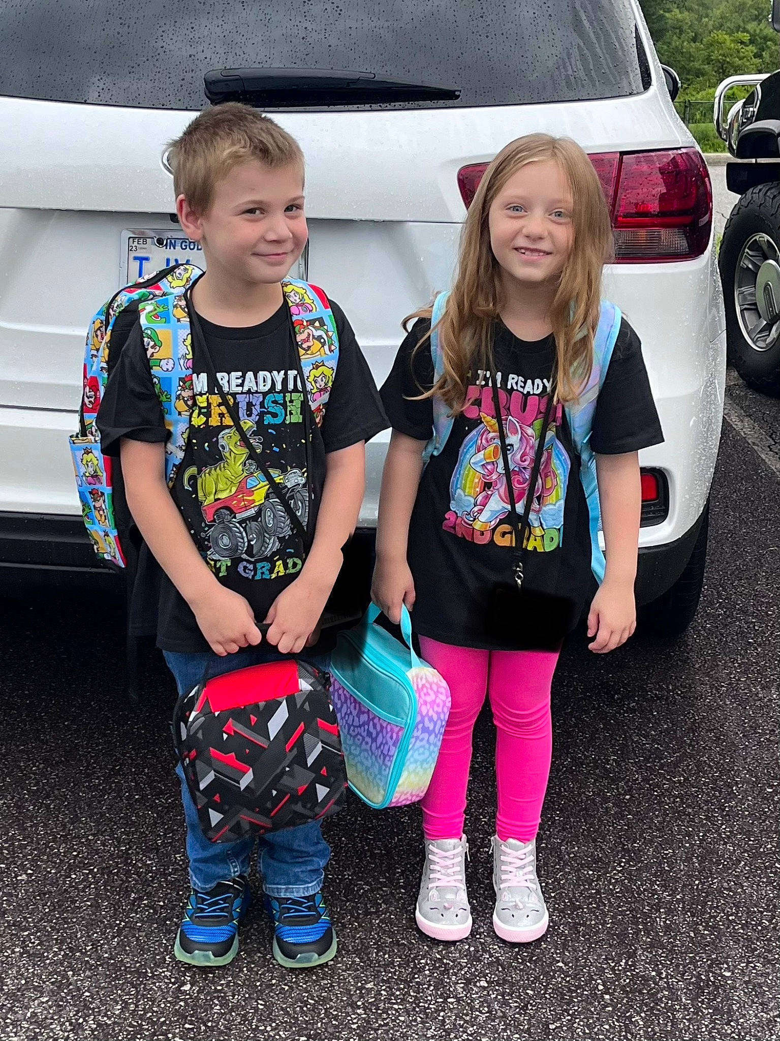 Pyper is registered to the contest to win money with this photo: automotive_exterior, automotive_lighting, automotive_tire, bumper, car, child, cool, footwear, fun, joy, land_vehicle, motor_vehicle, person, shoe, smile, style, t_shirt, tire, trunk, vehicle