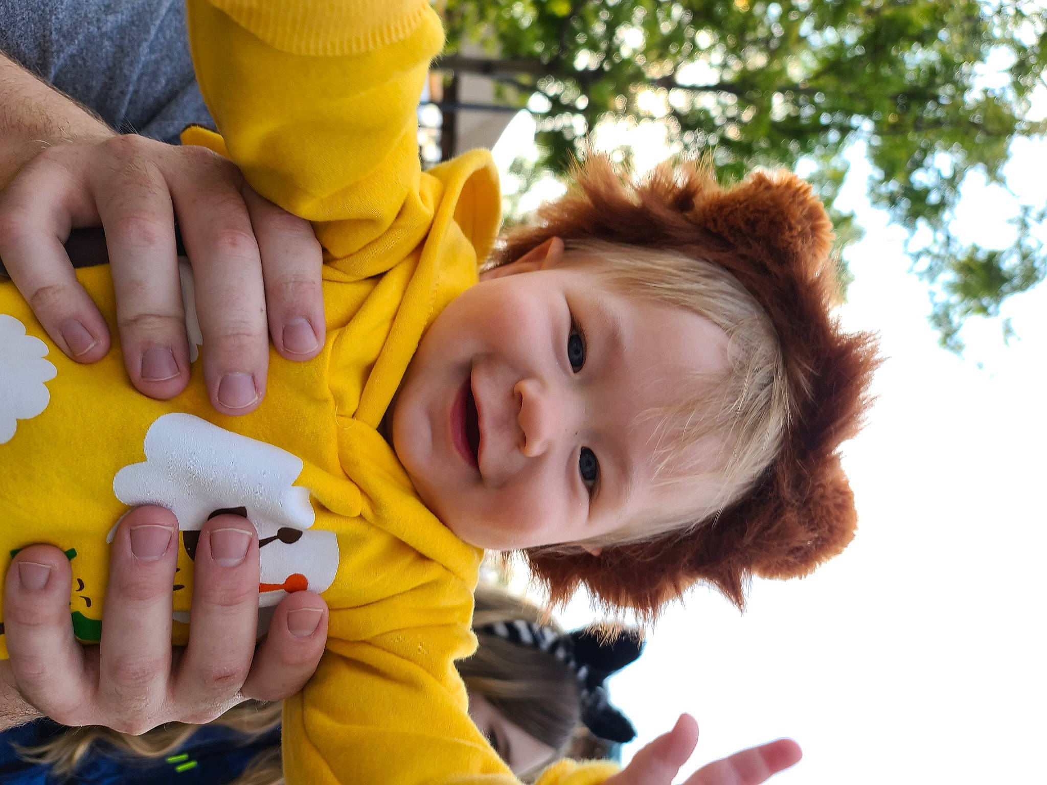 Mattox is registered to the contest to win money with this photo: baby, child, finger, fun, gesture, grass, hand, happy, joy, leaf, leisure, mouth, people_in_nature, person, plant, skin, smile, thumb, toddler, tree